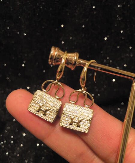 Alternative view of Hermes Amulettes Constance Earrings Gold Tone For Women